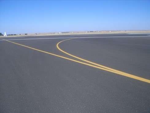 This picture shows an overview photo of an asphalt pavement with no distress.  The PCI of the pavement in the image is 100.